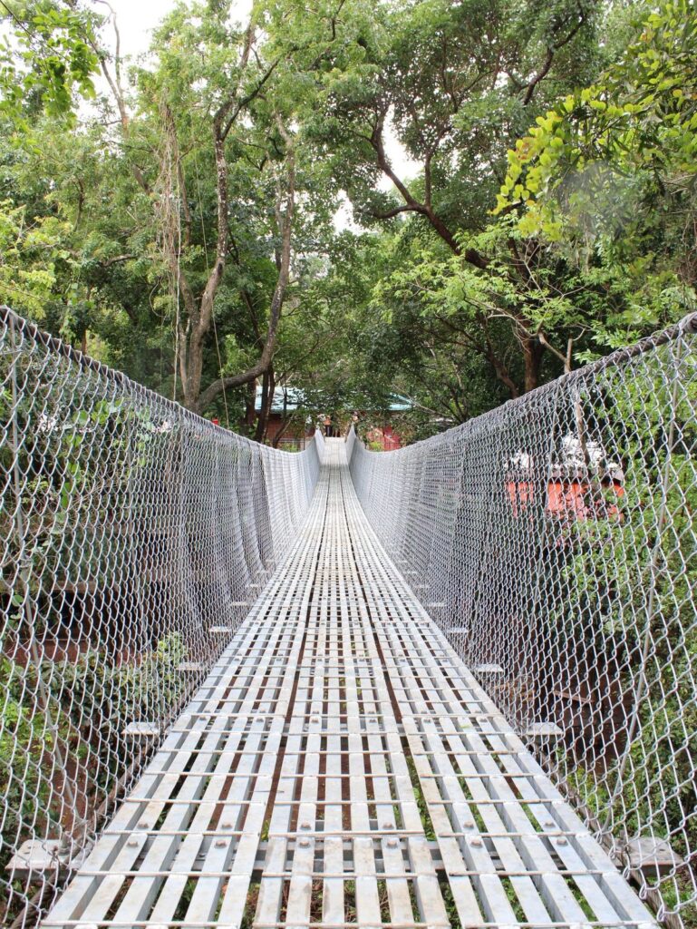 Galvanized steel walkway deck and wire mesh side fencing of the suspension bridge at Torda, North Goa, India, fabricated by Inter Tech Pvt. Ltd., Nepal